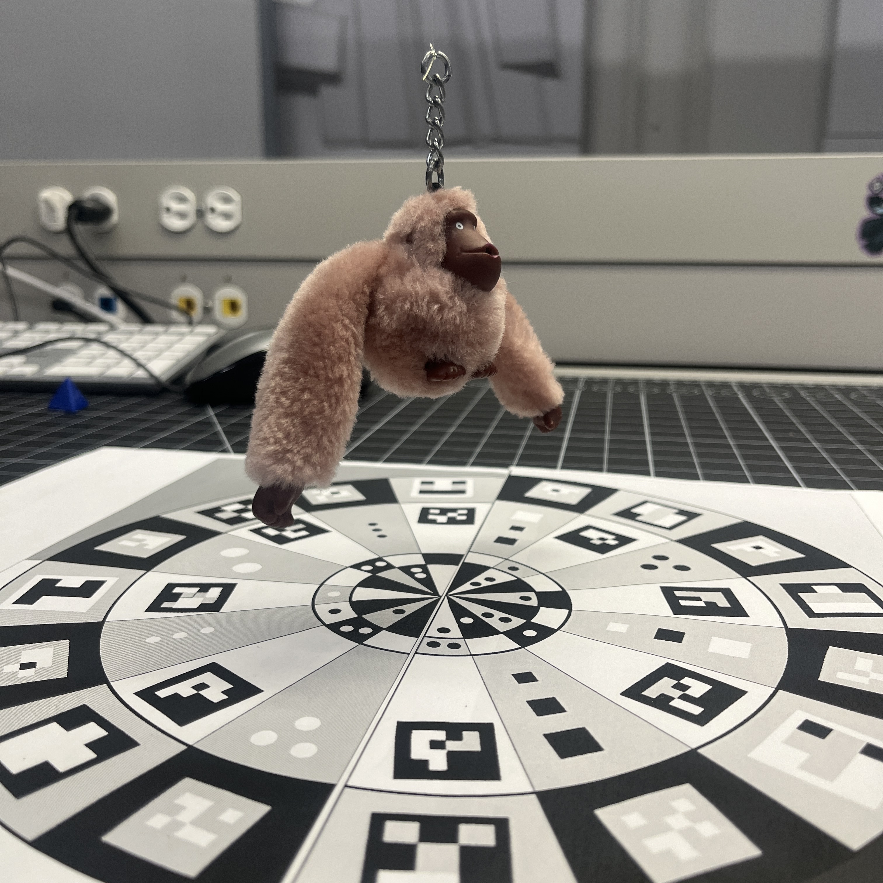 The scans kept resulting in large gaps in the bottom and in the fur, hoisting him with fishing wire seemed to help with that